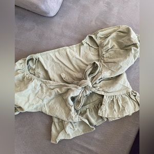Sage green top that ties in the front with puff sleeves